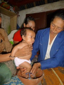 Nengah doesn't like baths, but she let granny administer this ritual cleansing