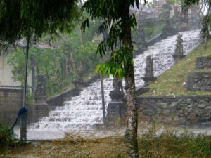 Rain making a waterfall down the temple steps